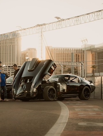 Factory Five Daytona replica with the hood open in Las Vegas